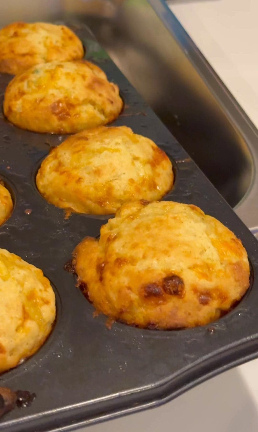Honey-jalapeño cheddar cornbread muffins in a baking tin