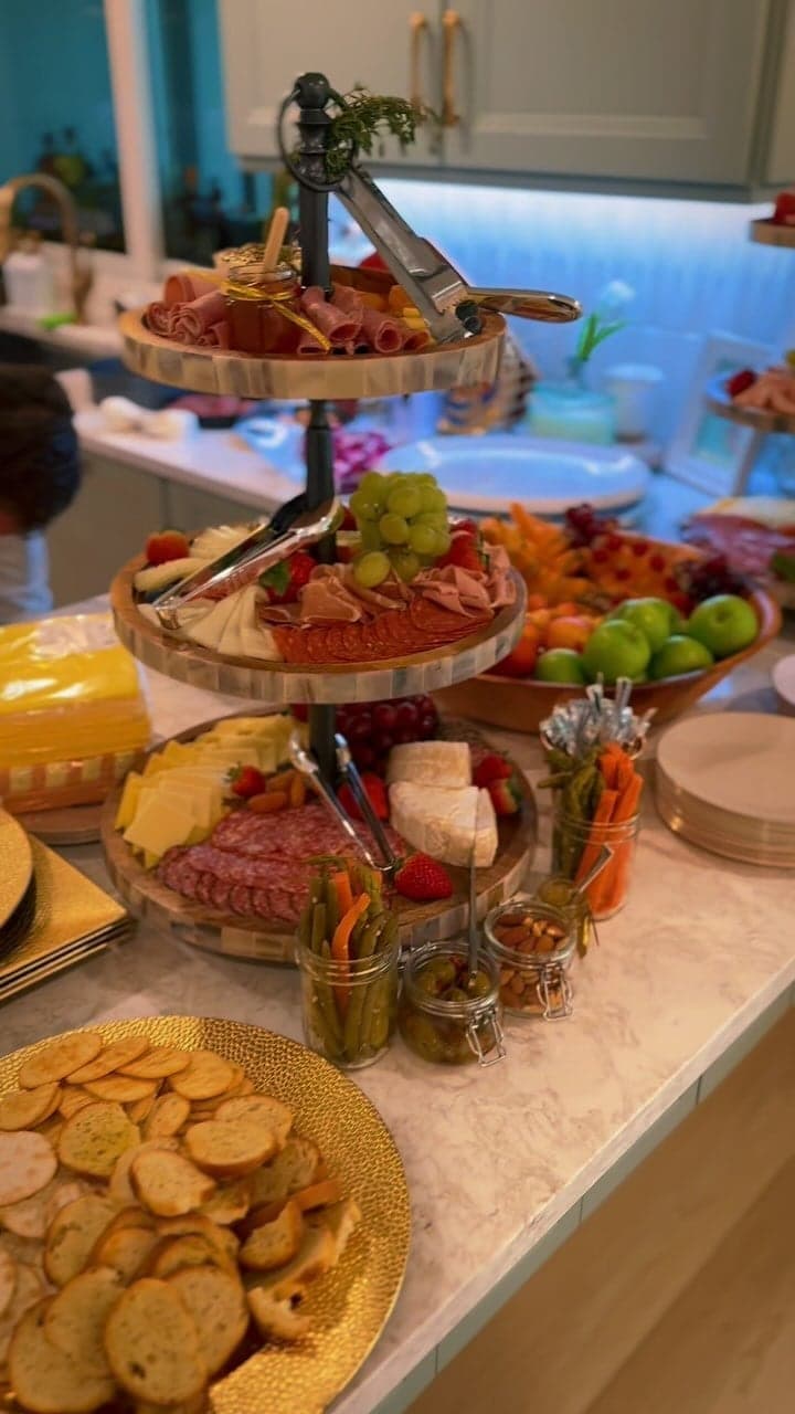 Tiered stand of charcuterie, cheeses and crackers