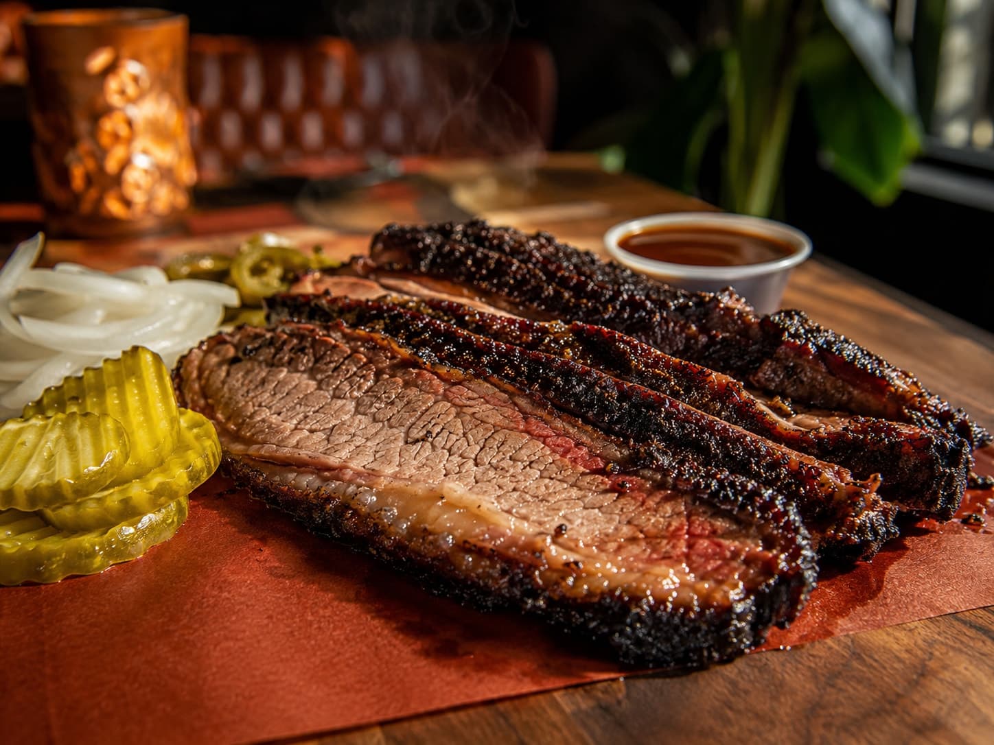 Chef Pablo's slow-smoked brisket, sliced to order with a deep peppered bark