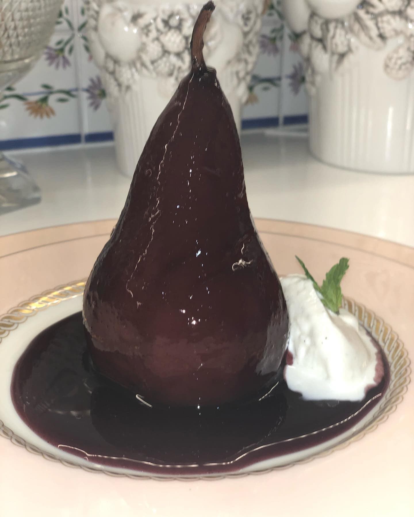 A Merlot-poached pear with vanilla ice cream