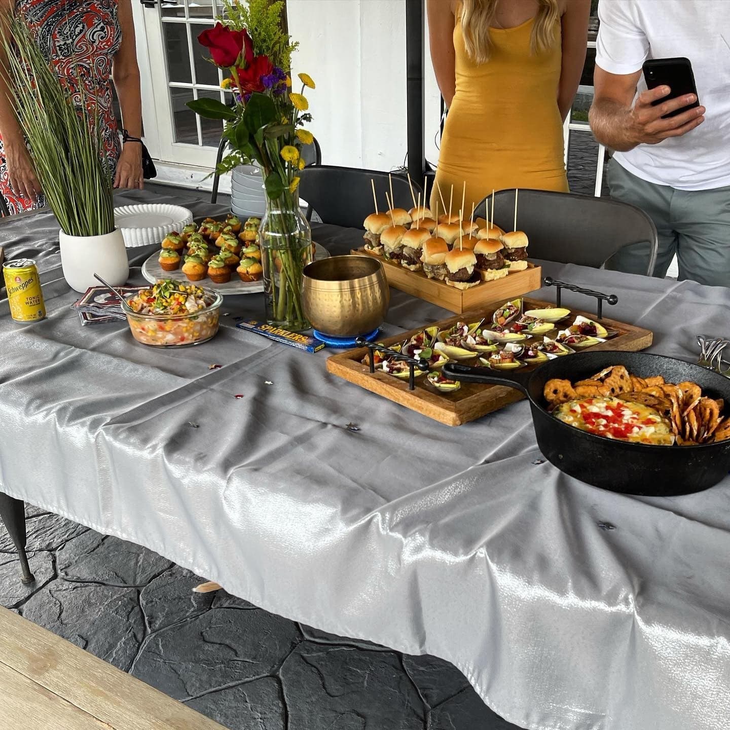 Party buffet set with sliders and appetizers